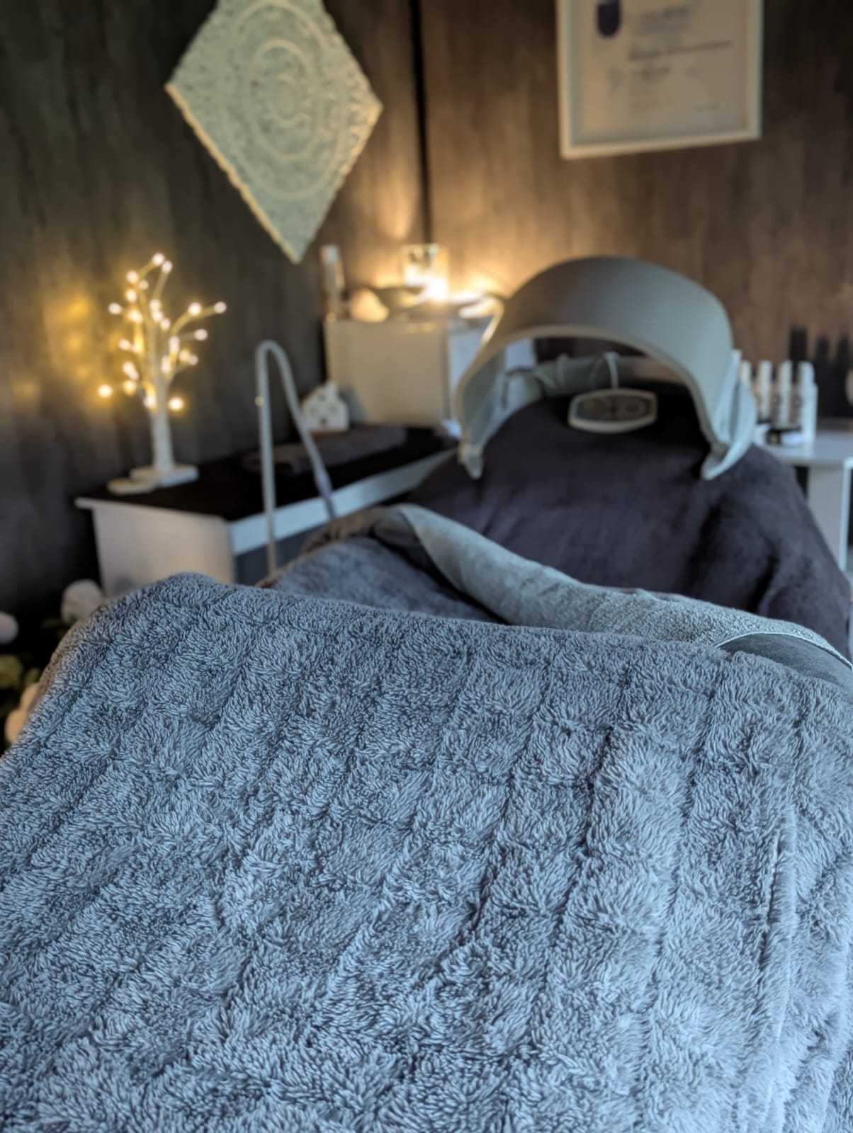Softly lit private treatment room with a treatment bed at The Tollwood Retreat, Crowborough